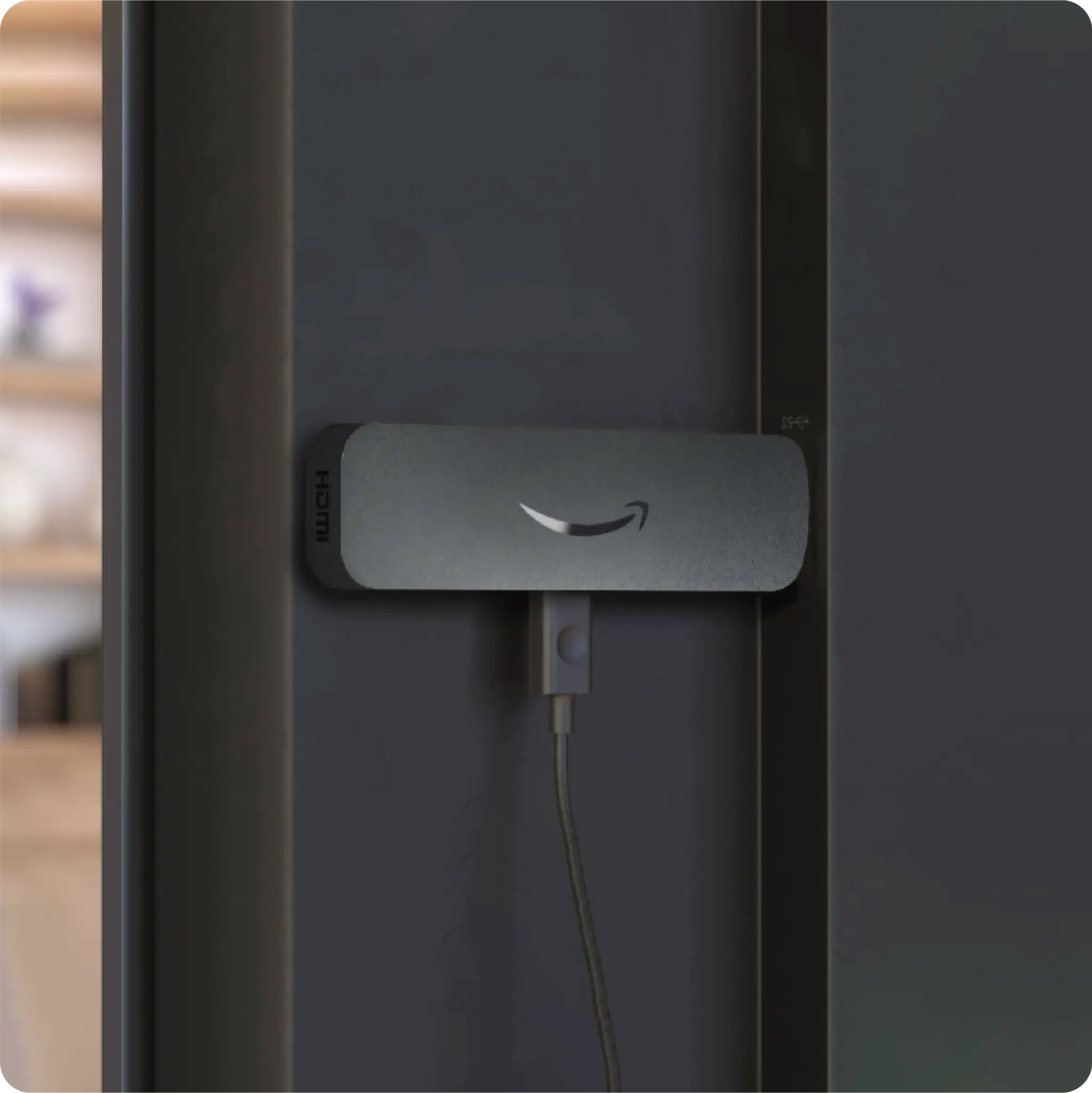 Amazon Signage Stick device close-up plugged into HDMI port